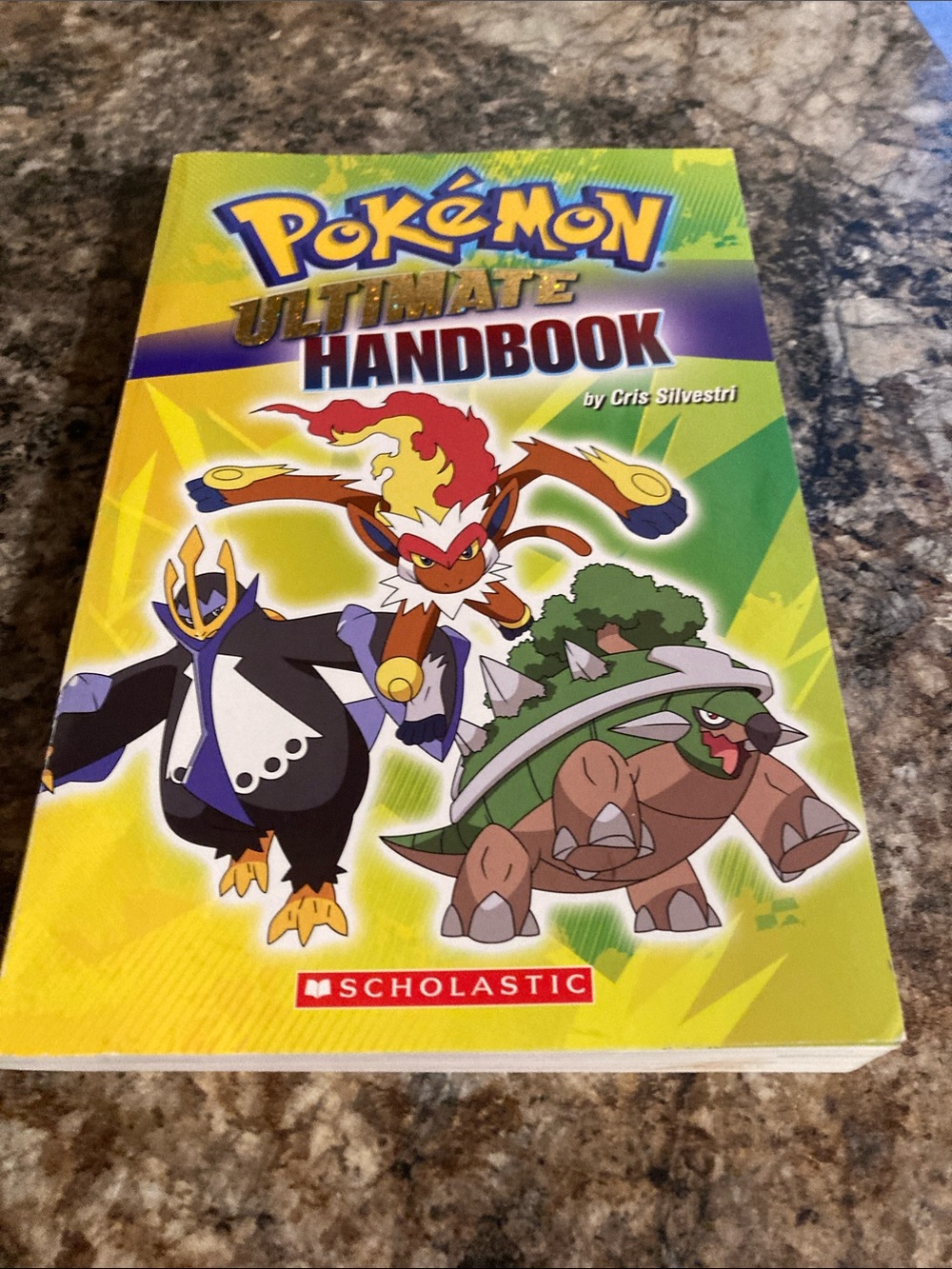 Scholastic Pokémon Ultimate Handbook - Yellow Green Purple